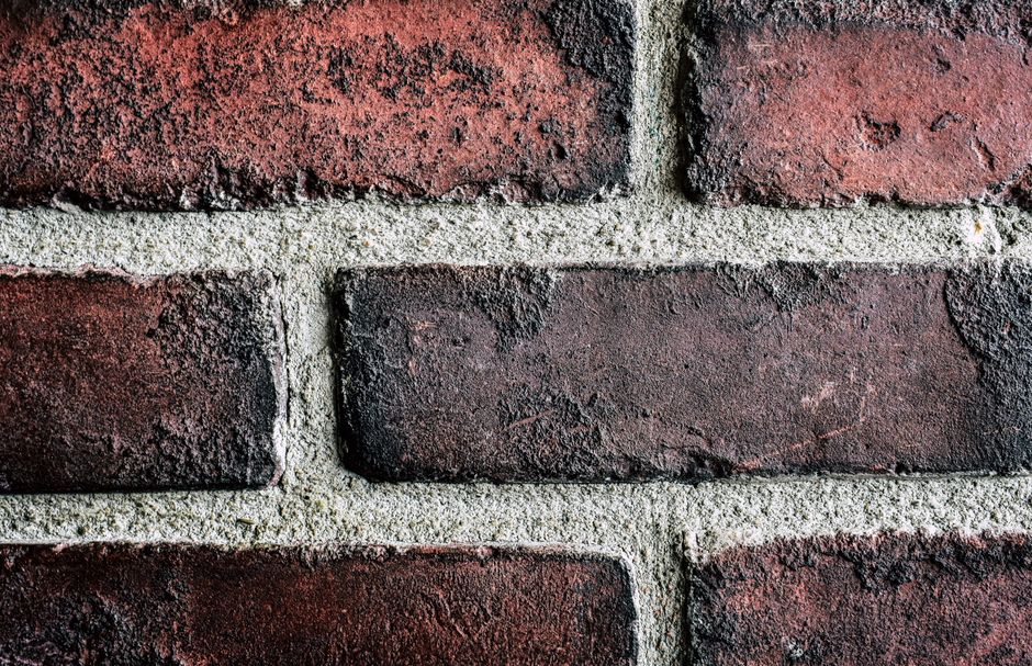 Tuckpointing mortar repair on brick wall
